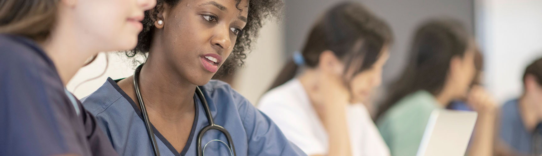 Nurses looking at a chart together.