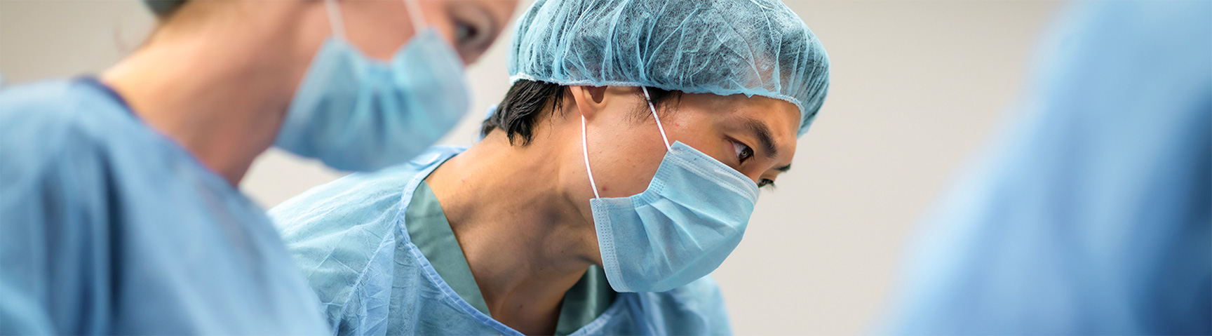 Surgeon in full uniform preparing for procedure