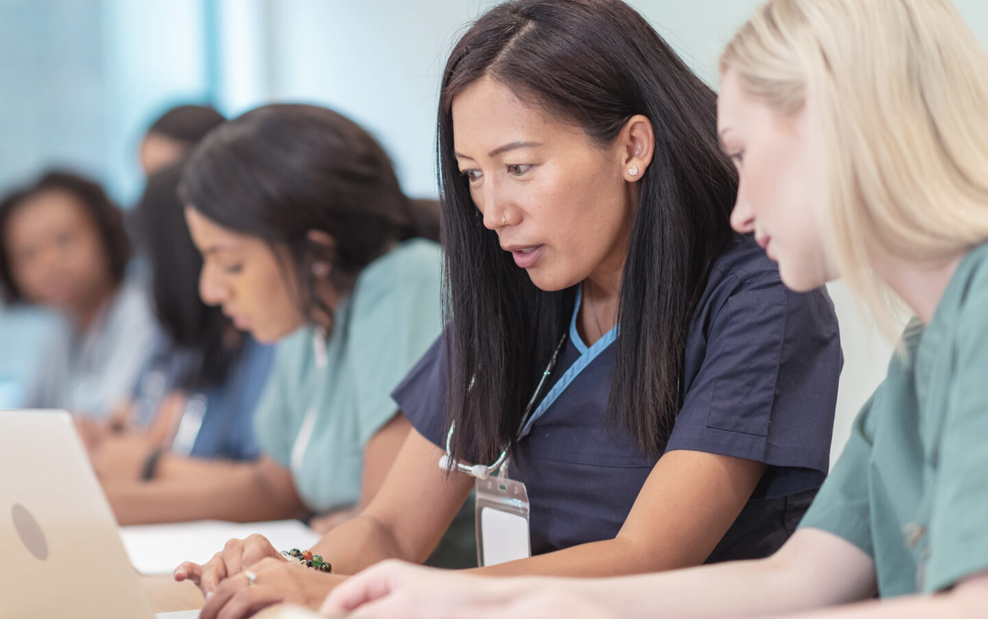 Education Services, nurses working on computer.