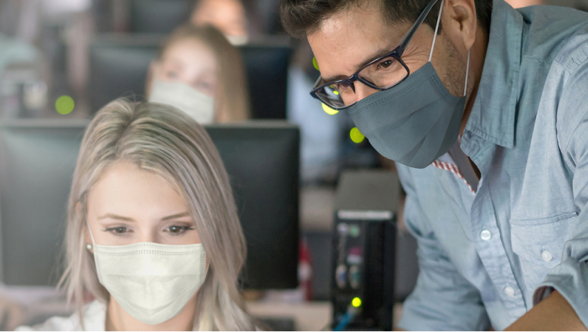 Canon Medical education services IT users on a computer.