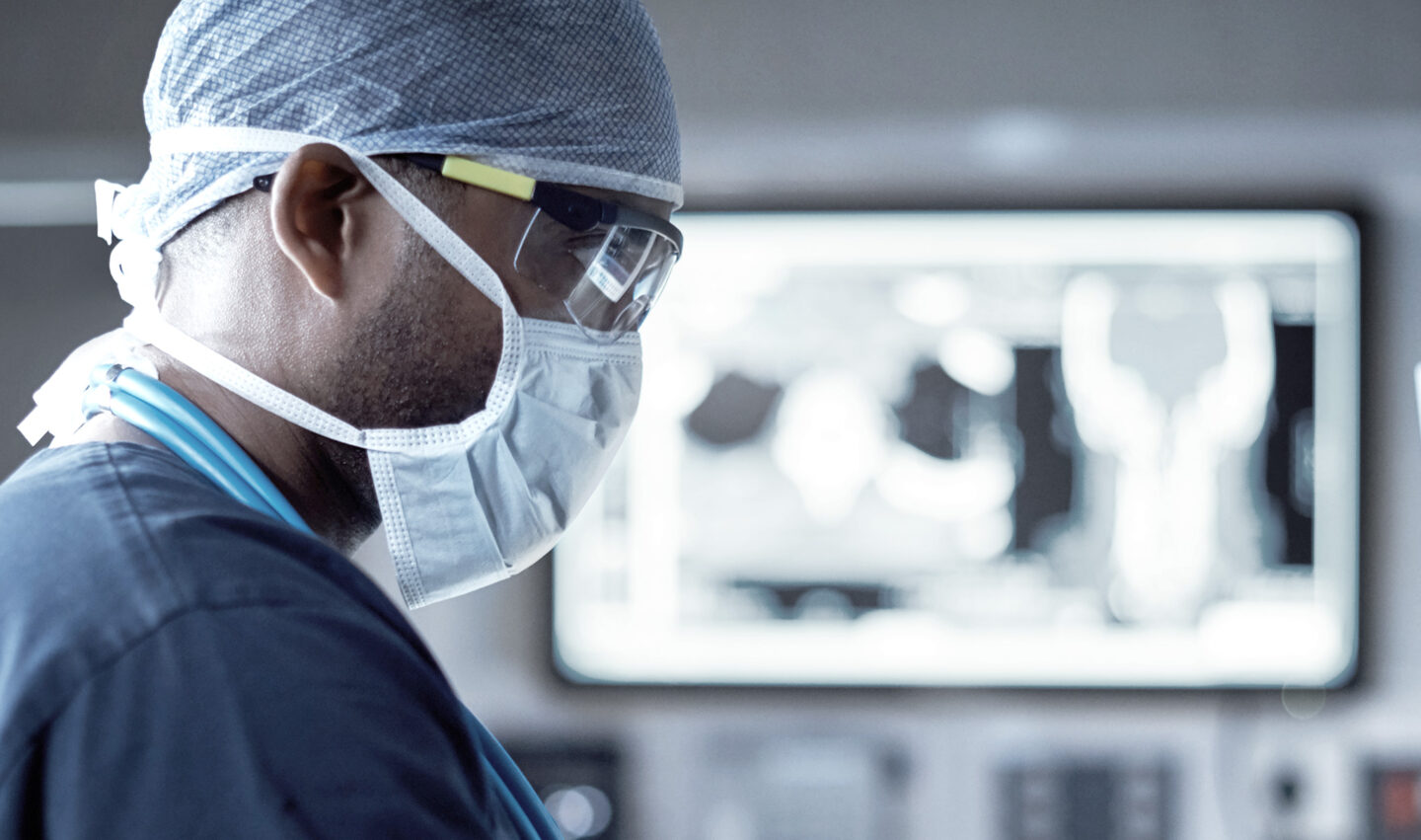 Clinician working on imaging.